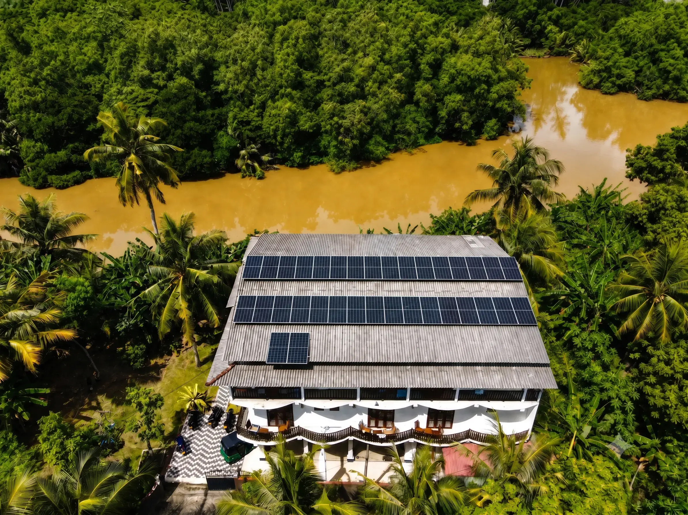 Riverwood Villa in daylight surrounded by lush greenery